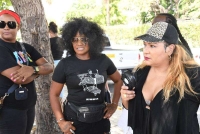 Singer Tanya Stephens (centre) and media personality Carlene &quot;Dancehall Queen&quot; Smith (right)join in the demonstration at Emancipation Park on Tuesday. 