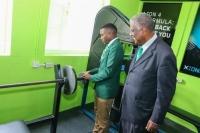 Dr Vincent M Lawrence (right) looks on as Head Boy of Calabar High School, Garfield Wallace familiarises himself with the equipment provided in the new Vincent Lawrence Gymnasium at the Kingston institution on Friday, November 1, 2019 following the grand opening.