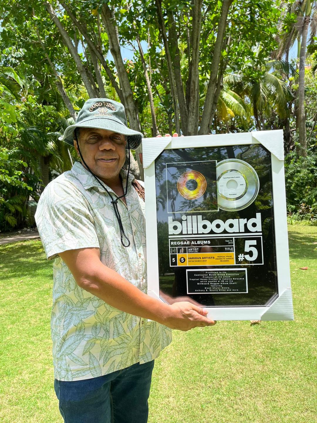 Contractor celebrates receiving his 4th Billboard plaque