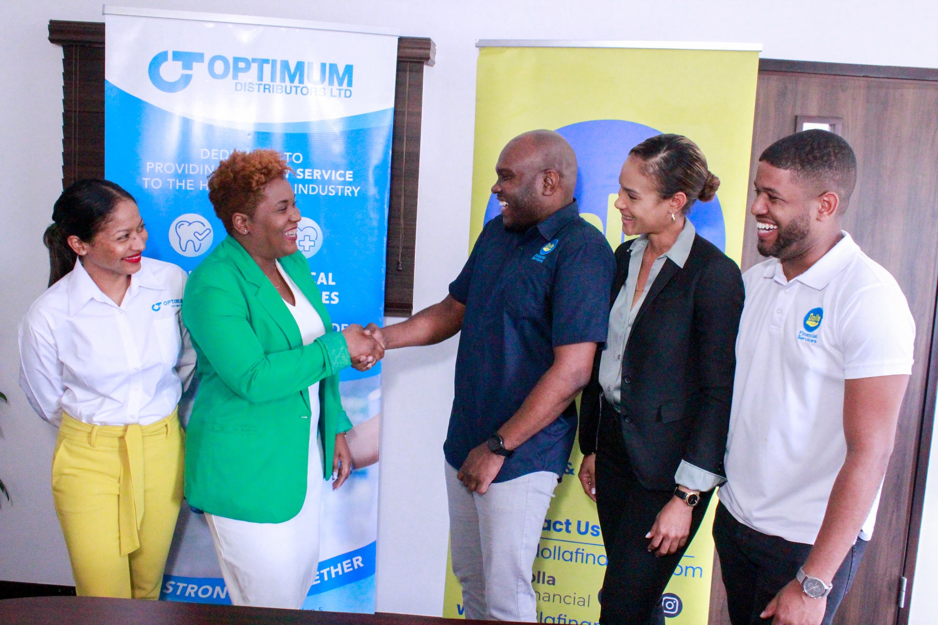 (From left to right) On Thursday, a joyous occasion unfolds as Tricia Dawson, Business Development Manager at Optimum Distributors, gladly shares the spotlight with Christina Garel Robinson, the Interim Chief Executive Officer (CEO) of Optimum Distributors, and Kenroy Kerr, the Chief Executive Officer (CEO) of Dolla Financial Services. Also present are Trevene McKenzie, Dolla's Group Chief Financial Officer (CFO), and Chad Wynter, Chief Legal Officer at Dolla Financials, all gathered for the momentous signing of the Memorandum of Understanding (MOU) between Dolla Financial and Optimum.