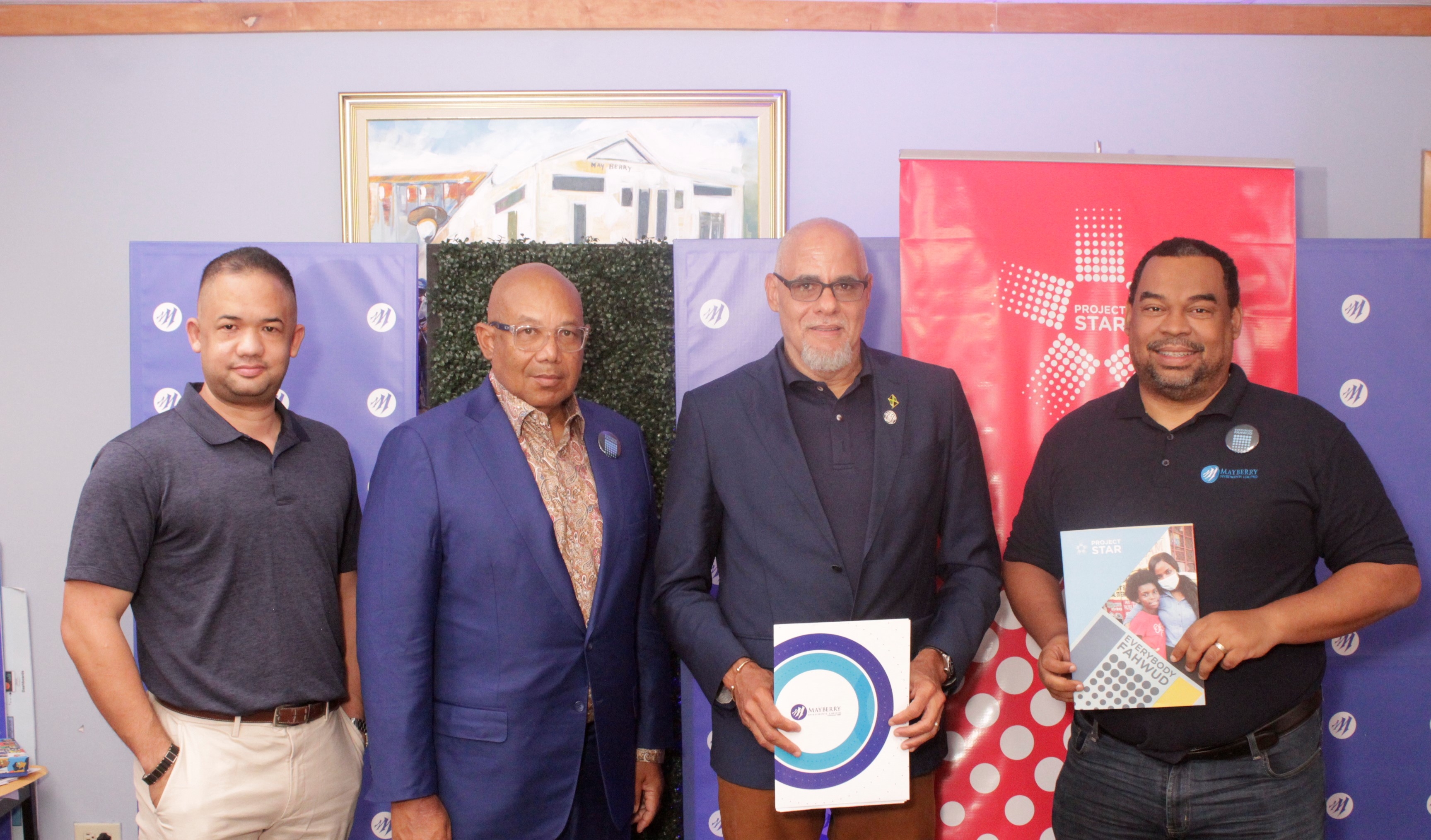 Mayberry Investments Limited CEO, Gary Peart (right), and Co-Chairman of Project Star Keith Duncan (centre) share a moment of satisfaction at the signing ceremony on Wednesday. Gazing forward with optimism is Executive Chairman of Mayberry Investments, Christopher Berry (left).