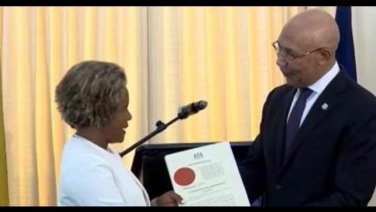 Senator Dr. Dana Morris Dixon received her instruments of appointment from Governor General Sir Patrick Allen during a ceremony at King's House.