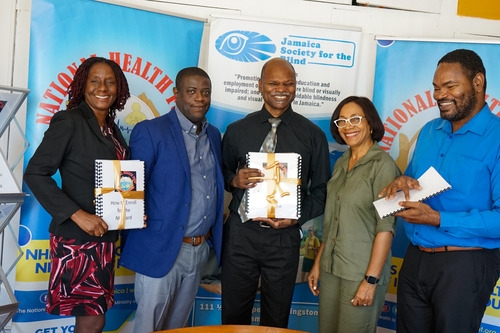 NHF’s CEO, Everton Anderson [second left] and Director of Health Promotion, Public Relations and Customer Care, Shermaine Robotham [second right] share a photo with Vice Principal of the Salvation Army School for the Blind, Sherine Whyte [left], Daemion McLean, JSB chairman [right] and Conrad Harris, JSB president [center] after presenting the booklets during the ceremony on Thursday, April 25, 2024.