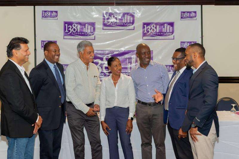 Baord members of 138 Student Living in discussion following the extraordinary general meeting on Monday, March 20, 2023, at the Jamaica Pegasus hotel. From left are: Ian Parsard, chairman; Stephen Greig, company secretary: Peter Pearson, director; Marrynette Lee, director; John Lee, director; Cranston Ewan, CEO; and Seymour Millen, CFO.