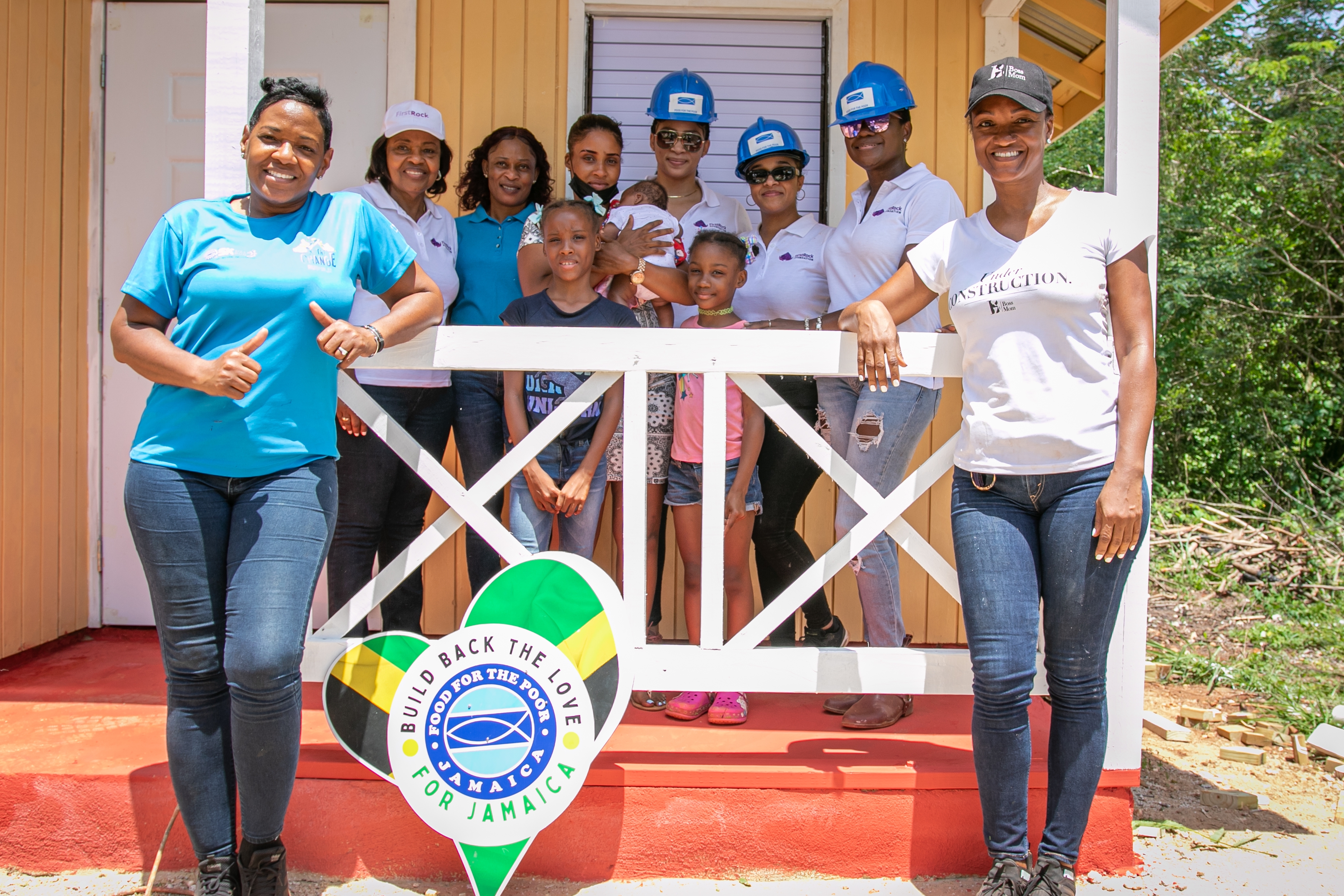 (Front row, from left to right) Marsha Burrell-Rose, Business Development and Marketing Manager for Food for the Poor, beams with pride standing alongside the adorable children of the Boss Mom recipient, Mahalia and Oshay, with the support of Michelle Gordon, IDEATOR and Founder of IMAGINIT Services. Sharing the spotlight recently on site are a passionate team of advocates (back row, from left to right): Pauleen Reid, Director of Firstrock Foundation; Shanah Archibald, Mission and Social Outreach Manager of Food for the Poor; Olevea Ryan, Boss Mom recipient, holding her newborn baby; Khadije Swaby, Marketing Support Officer at FirstRock; Santanio Husi, Senior Executive Assistant; and Karen Philips, Director of Firstrock Foundation.