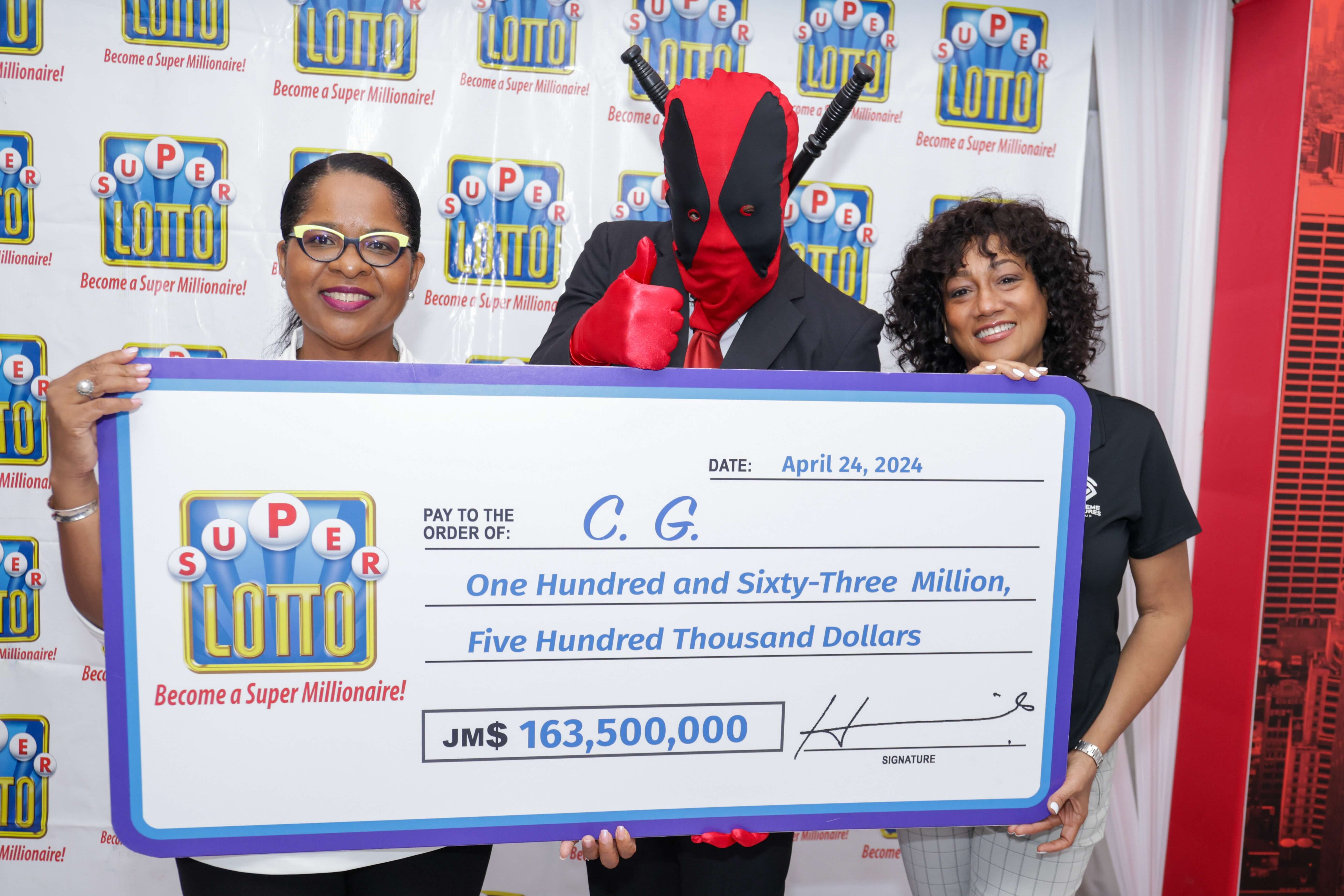 Heather Goldson, (r) Chief Marketing Officer Supreme Ventures Limited and Debbie Green, General Manager, IGT celebrate the Super Lotto win with CG