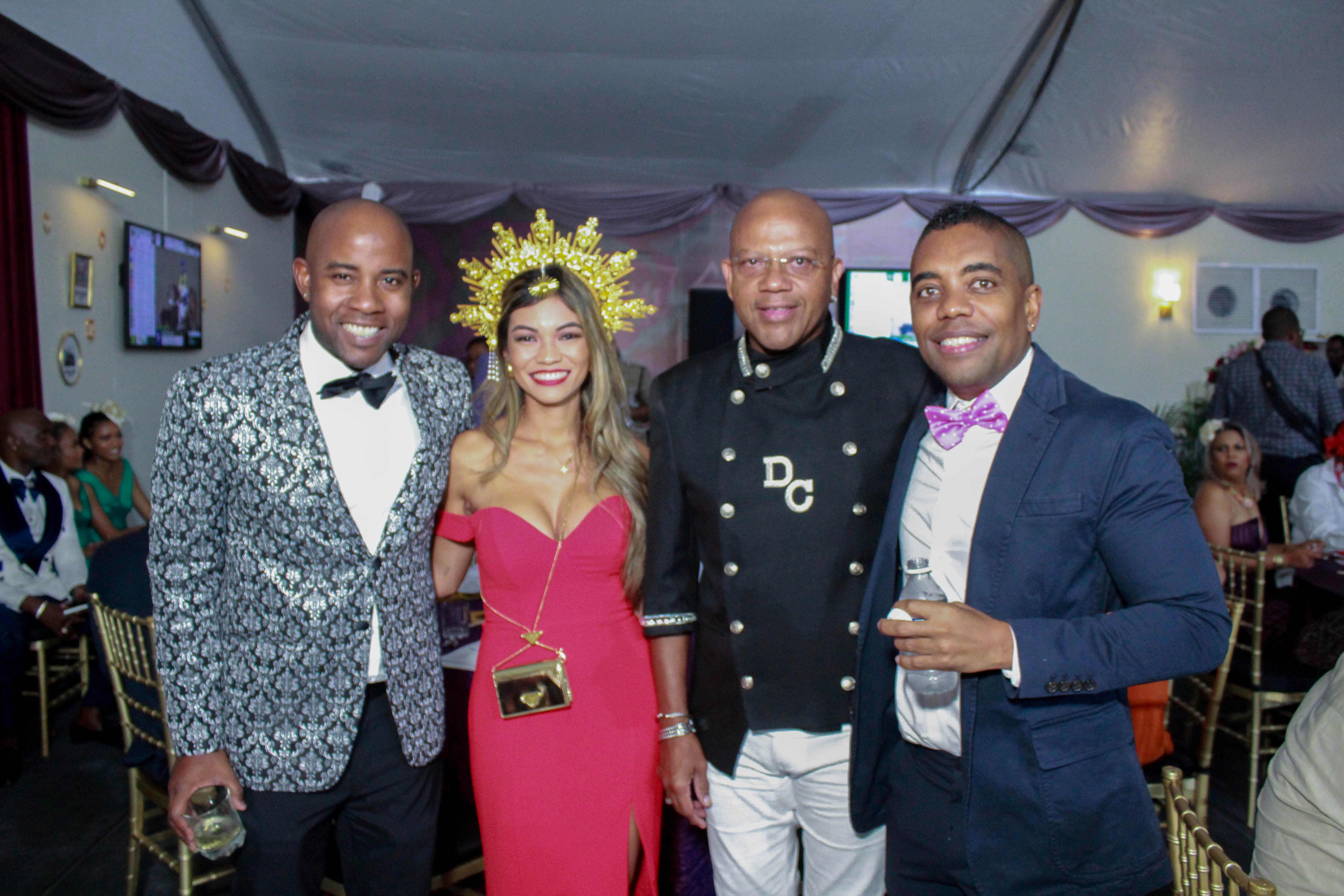 Saturday's Mouttet Mile at Caymanas Park brought together style and horsepower enthusiasts alike! Co-Founder of the FirstRock Group, Ryan Reid, shares the spotlight with Mayberry Investments Limited's Vice President of Marketing, Stephanie Harrison, alongside Don Creary and Kimani Robinson. Their charisma and the vibrant energy of the event turn a simple photo op into a memorable snapshot of lifestyle and social camaraderie.