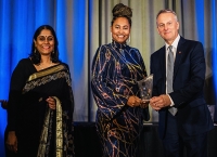 Ranjani Rangan Chairperson Elect, International Trade Council (l) looks on as Nayana Williams CEO Lifespan Spring Water collects the Go Global award from Hon David Wells, Chairman of the International Centre for Trade Transparency and Canadian Senator