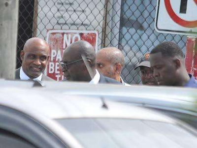 Former Education Minister Ruel Reid (second left) and CaribbeanMaritime University President Professor Fritz Pinnock (left) about toenter the Corporate Area Parish Court in Half-Way-Tree, St Andrewon October 10, 2019 for a bail hearing. Both men, along with Reid&#039;swife Sharen and daughter Sharelle, as well as Jamaica Labour PartyCouncillor Kim Brown Lawrence are facing multiple charges in a multimillion-dollar fraud case.
