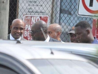 Former Education Minister Ruel Reid (second left) and CaribbeanMaritime University President Professor Fritz Pinnock (left) about toenter the Corporate Area Parish Court in Half-Way-Tree, St Andrewon October 10, 2019 for a bail hearing. Both men, along with Reid&#039;swife Sharen and daughter Sharelle, as well as Jamaica Labour PartyCouncillor Kim Brown Lawrence are facing multiple charges in a multimillion-dollar fraud case.