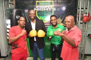 Suga Olympic Boxing Gym founder and coach Lindel &quot;Suga&quot; Wallace (right) and his boxer Daron Weir (left) pose for photos with Jamaica Boxing Board President Stephen &quot;Bomber&quot; Jones (second left), and J Wray &amp; Nephew Marketing Manager Pavel Smith at the launch of the new Fight Nights boxing series at J Wray &amp; Nephew headquarters in St Andrew on Wednesday evening.