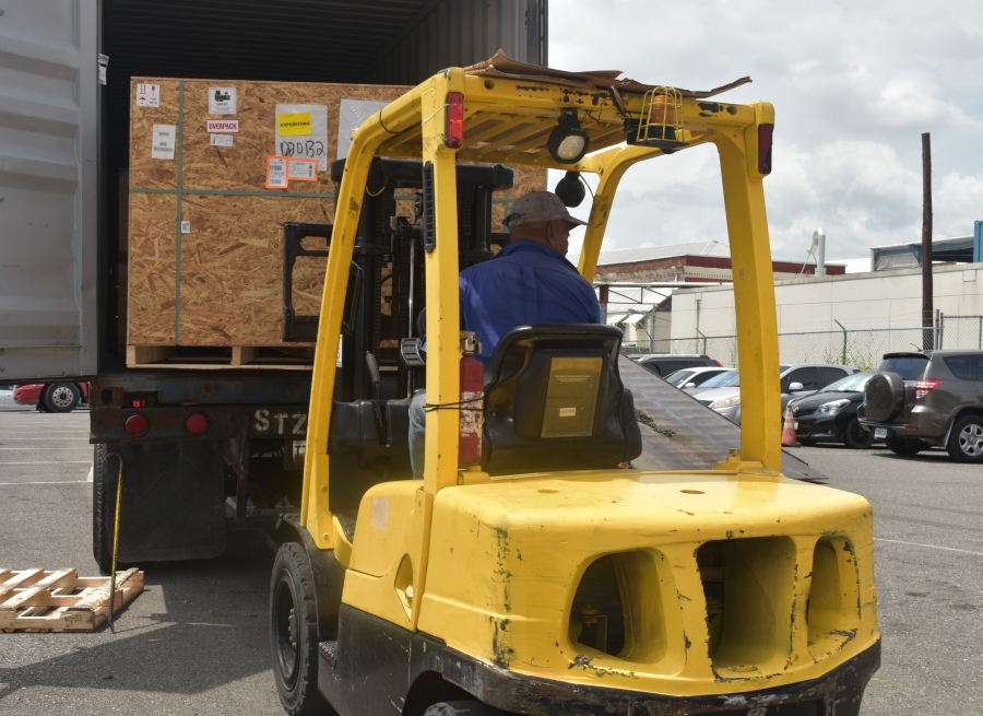 Imaging showing employee of Arel Limited unloading the boxes for the components of the X-ray machines during the arrival of the shipment of two X-ray machines that were delivered on Wednesday, September 27, 2023 in the parking lot at the Kingston Public Hospital.
