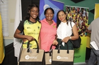 (from left to right) Sunshine Girl Crystal Plummer, Coach Connie Francis, and Rachel Kirlew, Assistant Vice President of Investment Banking at Mayberry Investments, pose for a photo during the launch of the reward programme for the Sunshine Girls by Supreme Ventures and Mayberry Investments at the Jamaica Olympic Association on Monday.