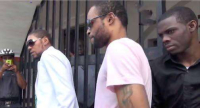 Vybz Kartel, Shawn Storm and Kahira Jones shortly after sentencing in 2014