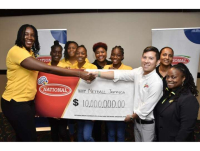 Director of sales and marketing of National Baking Craig Henderickson (second right) hands over his company&#039;s symbolic cheque to Sunshine Girls Captain Jhaniele Fowler during a press event at Jamaica Pegasus hotel in New Kingston recently. President of Netball Jamaica Tricia Robinson (right), along with other members of the Sunshine Girls team look on
