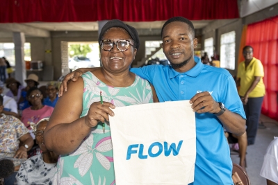 &quot;Yes I win!&quot; exclaims Monica Roofe-Woolcock as she accepts her spot prize from Flow Portmore Retail Store, Tech Expert, Christopher Smith.