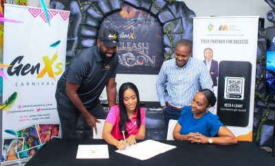 (front row, left to right) Mala Morrison, Managing Director of GenXS Jamaica (left), officially recently seals a groundbreaking deal with Nanisha Lee, Business Development Manager at McKayla Financial Services, solidifying the strategic partnership between McKayla Financial Services and GenXS. Witnessing this pivotal moment are (back row, left to right) Kino Johnson, Director of Entertainment and Live Events at GenXS Jamaica, and Kamal Powell, Head of Marketing at Supreme Ventures Limited.