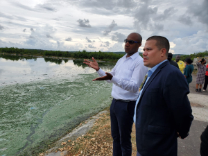 Minister without Portfolio in the Ministry of Economic Growth &amp; Job Creation, Senator Matthew Samuda, is shown the operations of the Greater Portmore Ponds Wastewater Treatment Plant by Senior Project Manager of National Water Commission, Kieran Cadogan, which was officially commissioned yesterday (September 29) in Portmore, St. Catherine.
